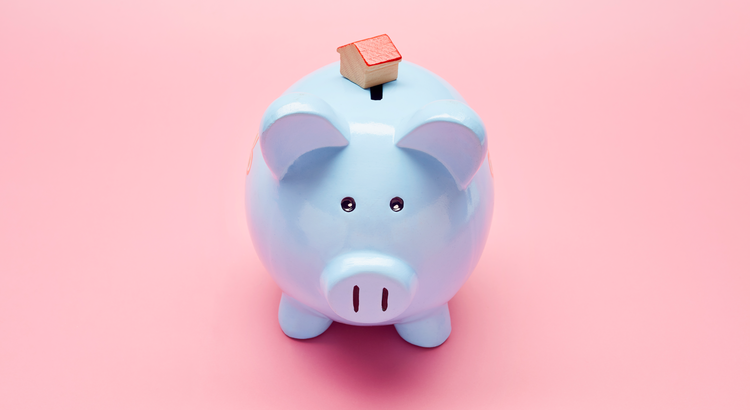 blue piggy bank against pink background